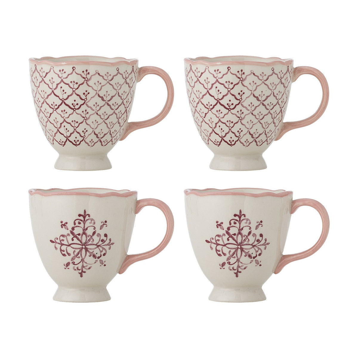 Set of 4 stoneware Wonderland Christmas mugs, 525ml, cream with pink scalloped rims and handles, two in a diamond trellis pattern and two with a pink floral motif, footed bases, on a white background.