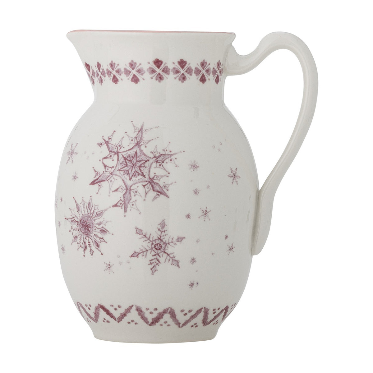 White stoneware Christmas jug with curved handle and pouring lip, featuring pink snowflake motifs and a patterned border, set against a plain white background.