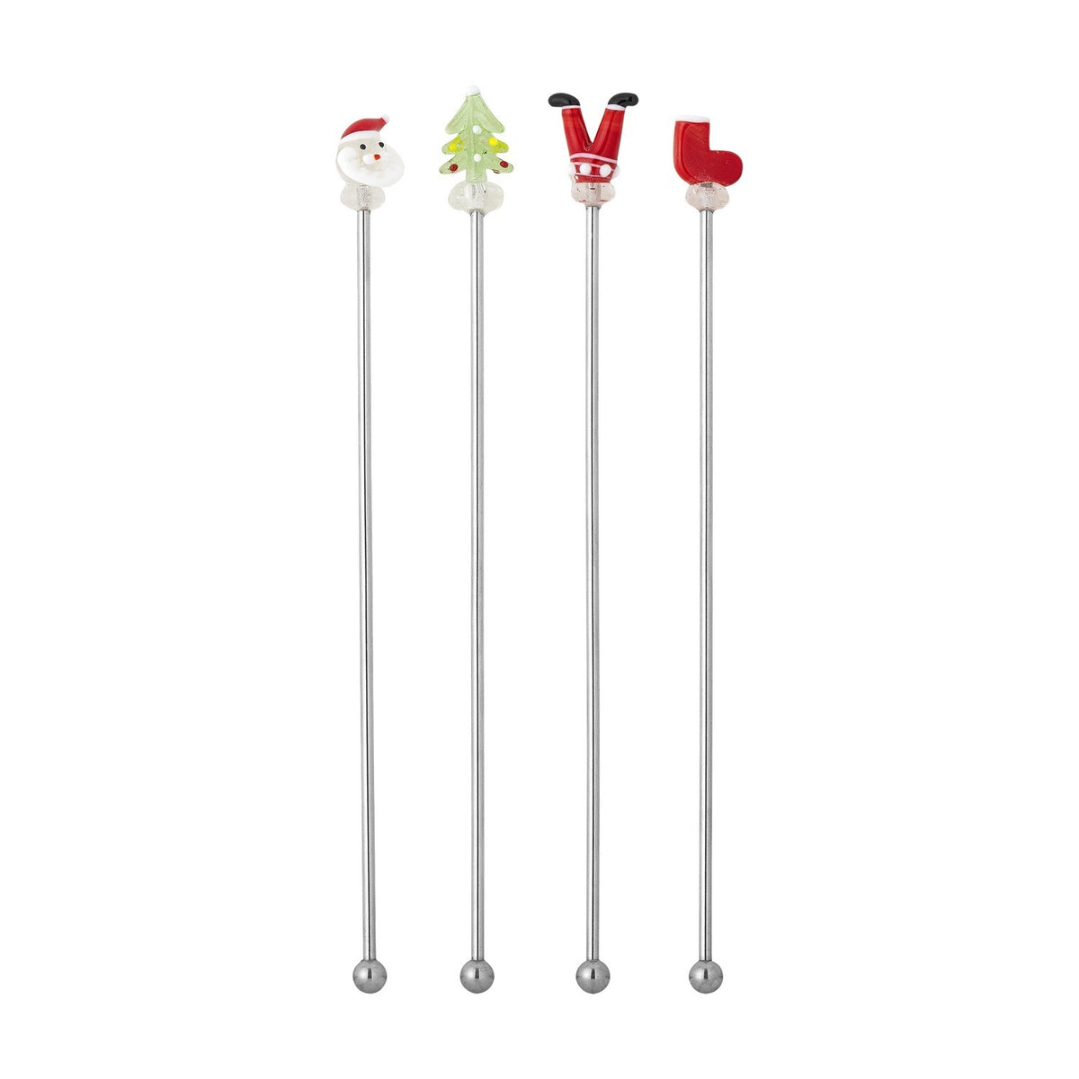 Set of four stainless steel cocktail stirrers with glass figure toppers—Santa face, Christmas tree, Santa legs and a stocking—on a plain white background.