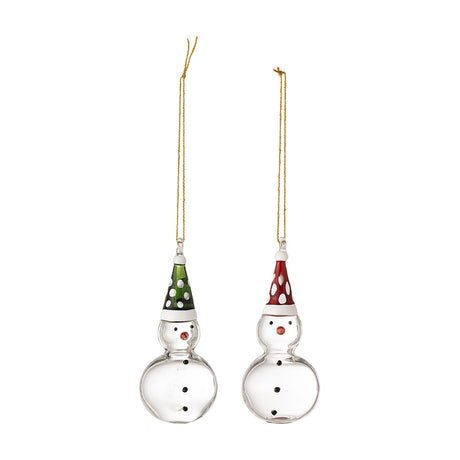 Set of two clear glass snowman Christmas decorations with dotted hats in green and red, black eye and button details, and gold hanging cords, on a white background.