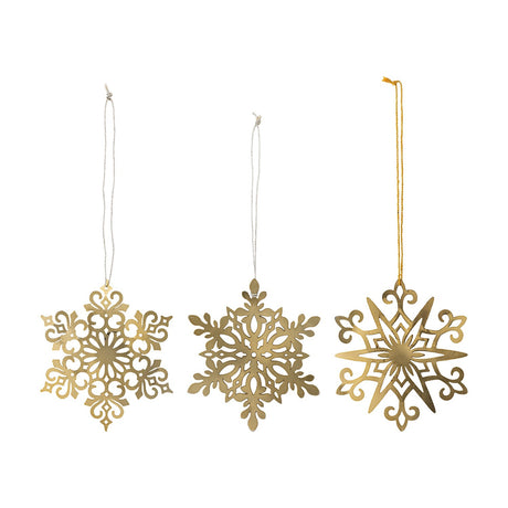 Mani Iron Christmas Tree Decorations Set of 3 in gold, three pierced metal snowflake ornaments with scrolled, leaf, and star designs, hung on cord against a white background.
