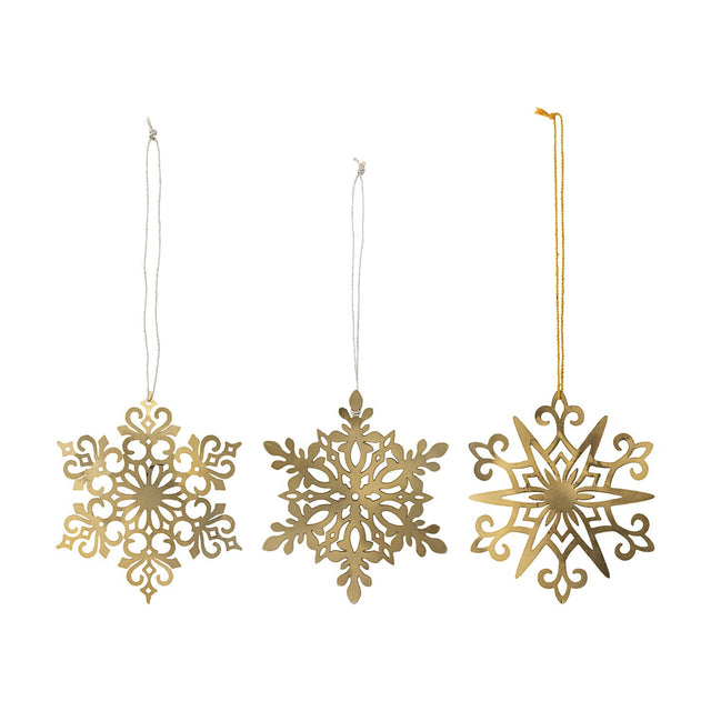 Mani Iron Christmas Tree Decorations Set of 3 in gold, three pierced metal snowflake ornaments with scrolled, leaf, and star designs, hung on cord against a white background.