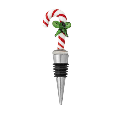 Lynn Christmas wine stopper with a red and white striped glass candy cane handle and green glass bow, set on a ridged silicone and stainless steel cone, shown on a white background.