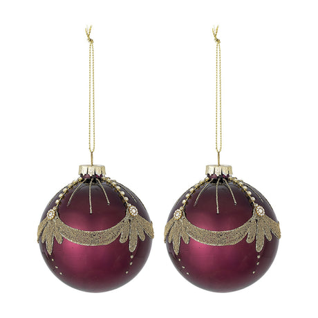 Suman Round Glass Christmas Baubles Set of 2 in red, each with a glossy finish, gold glitter swag, beaded lines, jewel studs and leaf drops, hung with gold cord on a white background.