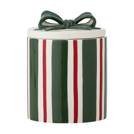 Marnia Striped Christmas Storage Jar with Lid, a round stoneware jar in green, red and white vertical stripes with a green bow-topped lid, shown on a plain white background.
