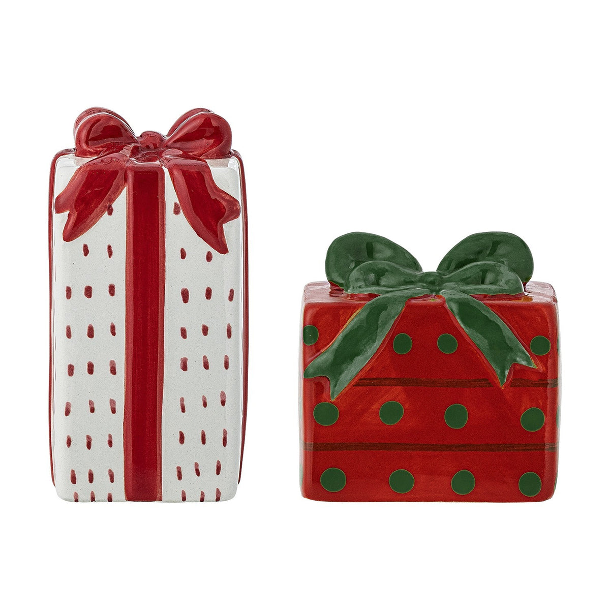 Marnia ceramic Christmas salt and pepper shakers shaped as gift boxes, one tall white parcel with red stripe and bow, one low red parcel with green dots and bow, on a white background.