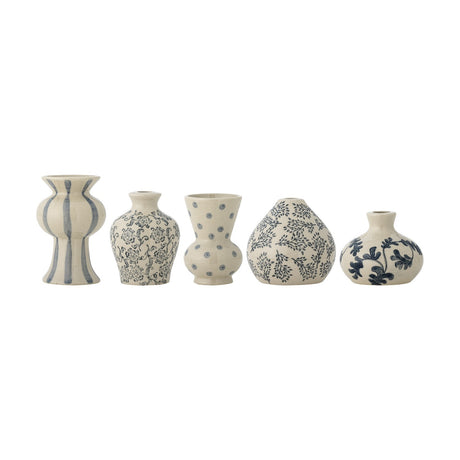 Quinto Striped Stoneware Vases, set of five small ceramic vases in varied shapes, each handpainted in blue with stripes, dots, or floral and leaf patterns, on a plain white background.