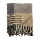 Hamisha Grey Throw in a folded block check of charcoal, grey, and beige, with long chunky fringe, shown on a plain white background.
