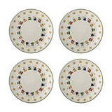 Set of four cream stoneware Christmas plates, each with a green rim, a border of gold stars, and a ring of angel mice playing trumpets around a plain centre.