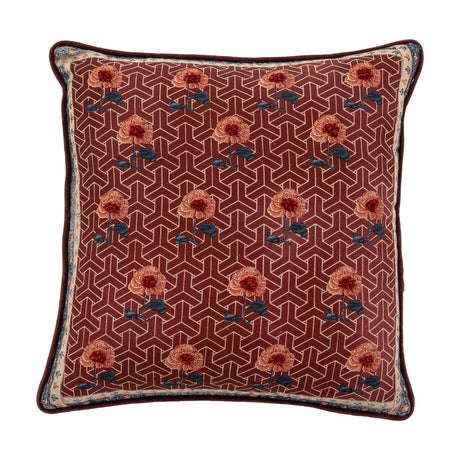Zharai Geometric Cotton Cushion in red, featuring a lattice pattern with rows of small floral motifs, patterned border, and piped edge, shown on a plain white background.