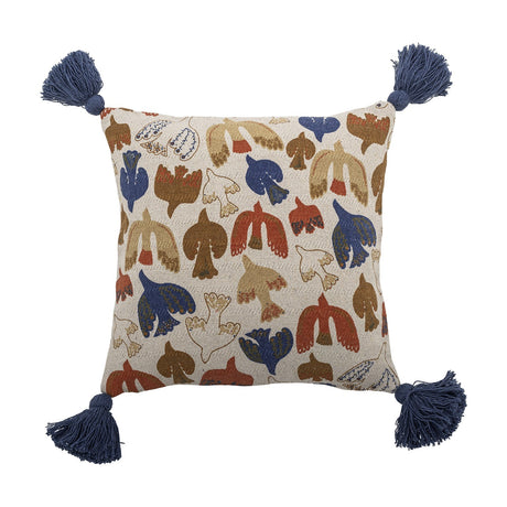 Square cotton cushion with stylised bird print in rust, blue, tan and cream, navy tassels at each corner, shown on a white background.