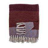 Isnel Red Striped Throw in multicoloured stripes with a ribbed, corded weave, folded with knotted fringe tassels visible, shown against a plain white background.