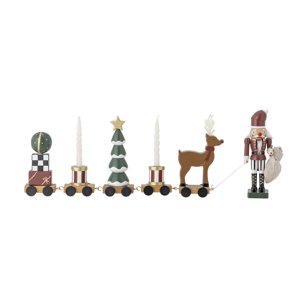 Vadim Christmas Decoration train on wheels with bauble on gift stack, striped drums flanking a snow-tipped tree, reindeer, and nutcracker figure, on a white background.