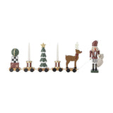 Vadim Christmas Decoration train on wheels with bauble on gift stack, striped drums flanking a snow-tipped tree, reindeer, and nutcracker figure, on a white background.