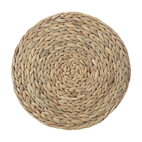 Ydun Water Hyacinth Placemat in natural, round woven design with chunky braided spiral pattern from centre to rim, shown on a plain white background.