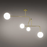 Lumorne 4 Light Glass Globe Chandelier in polished brass, with slanted metal rods at angled bends holding four varied-size opal glass globes, shown against a plain grey background.