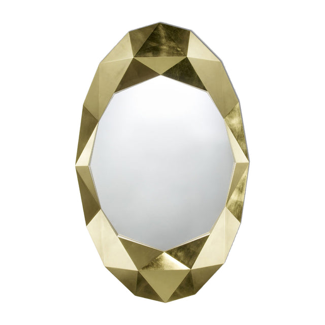Oval mirror set within a chunky faceted surround finished in hand applied gold leaf, an irregular outline on a plain background.