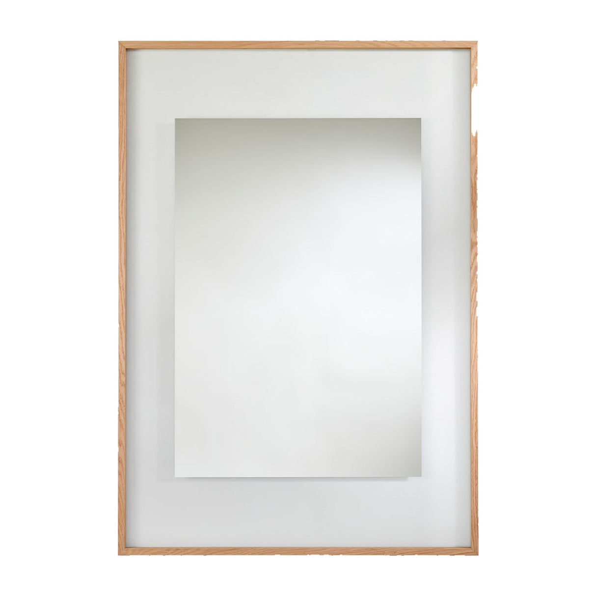Rectangular mirror in a solid oak frame with a wide partly transparent border around the mirrored centre, on a plain background.