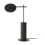 Rafaela LED Disc Table Lamp in matt black, featuring a flat round disc head on a slim arm crossing an upright stem, set on a cylindrical base, shown on a plain white background.