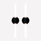 Pair of Roos LED Cylinder Disc Wall Lights in matt black, each with a round disc and vertical sandblasted acrylic tube lit warm white, on a plain light background.