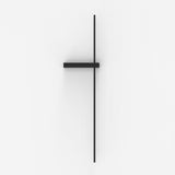 Rut LED Linear Wall Light in matt black, a slim vertical bar crossed by a short horizontal bracket in aluminium and iron, shown against a plain white background.