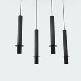 Rita Disc Pendant with Concrete Structure in black: four slim cylindrical pendants with iron heads and flat discs, hung at staggered heights on thin cables against a plain light background.