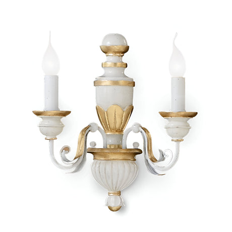 The Firenze 2 Light Wall Light - White is an elegant sconce featuring a vintage-inspired design with two candle-shaped bulbs. It offers a beautiful white and gold finish highlighted by ornate detailing, such as scroll-like arms that extend from a central fixture accented with gold, providing an ambient glow.