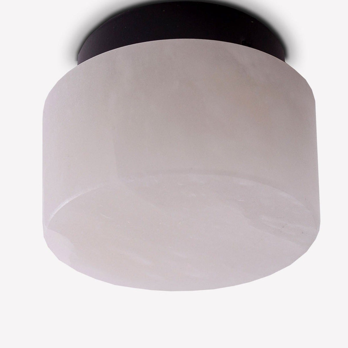Rock LED Alabaster Drum Flush Ceiling Light in Black, showing a cylindrical alabaster shade on a black aluminium base against a plain white background.