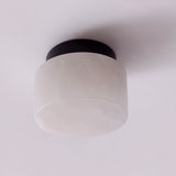 Rock LED Alabaster Drum Flush ceiling light with a black aluminium base, shown against a plain white background.