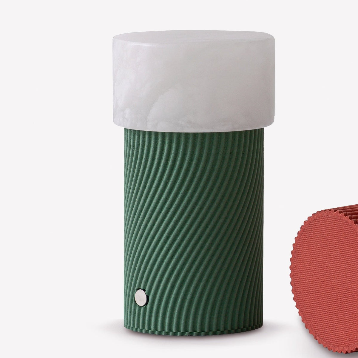 Rizzo LED Alabaster Rechargeable Table Lamp in Willow, featuring a cylindrical ribbed green base with a rounded white alabaster shade, shown on a plain background beside a red textured swatch.
