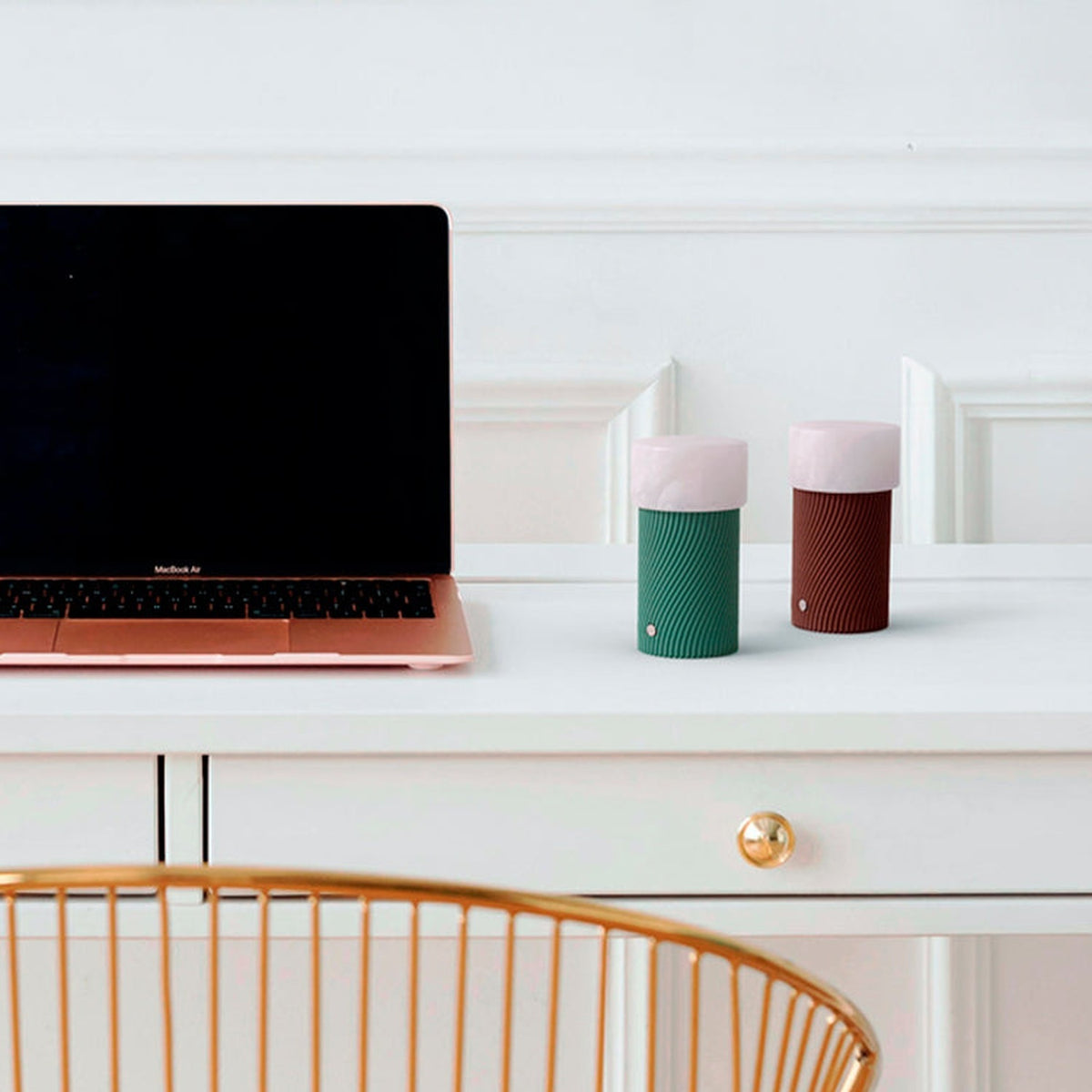 Rizzo LED Alabaster Rechargeable Table Lamp in Willow green, ribbed cylindrical base with alabaster shade, shown beside a rose gold laptop on a white desk.