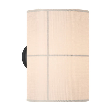 Rania cylinder fabric wall light with white cream shade divided into four panels by fine lines, mounted on a round black base, shown on a plain white background.