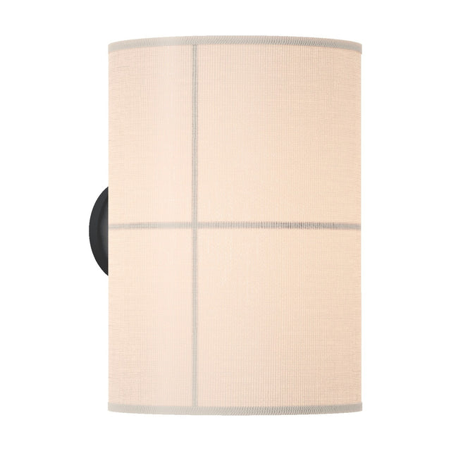 Rania cylinder fabric wall light with white cream shade divided into four panels by fine lines, mounted on a round black base, shown on a plain white background.
