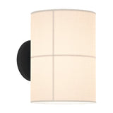 Rania Cylinder Fabric Wall Light in white cream with black round base, featuring a fabric shade divided into four panels by fine crossing lines, on a plain white background.