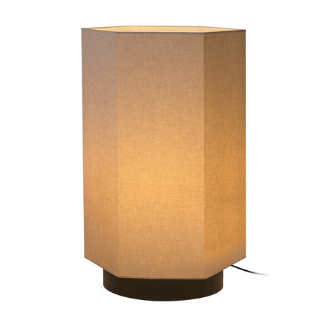 Roxi Fabric Floor Lamp with a hexagonal natural fibre shade and round dark brown base, glowing softly, shown on a plain white background.