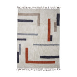 Jue Geometric Cotton Rug 200x140cm in Multi, a cream tufted rug with grey, navy, terracotta and taupe geometric bars and L-shapes, finished with knotted fringe on a white background.