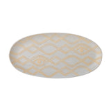 Newa Stoneware Tray in White, an oval ceramic tray with speckled glaze, interlocking wavy-line diamond pattern, two eye motifs, and a low rim, shown on a plain background.
