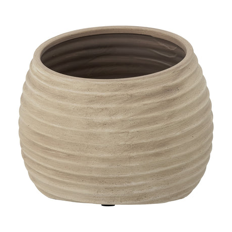 Cimmy Terracotta Plant Pot in beige, a rounded ribbed planter with horizontal grooves from rim to base and a glazed brown interior, shown on a plain white background.