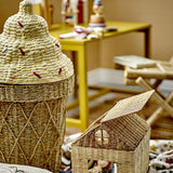 Cillie Seagrass Basket with Lid 72cm in Natural, shaped like a soft-serve cone with a woven criss-cross base and stepped swirl lid, shown beside a small wicker house box.