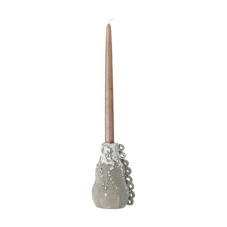 Souri Stoneware Candle Holder in grey, gourd-shaped with a bubbled drip glaze and looped side detail, holding a tall taper candle against a plain white background.