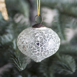 Nadine onion-shaped glass Christmas tree decoration in clear mosaic finish with faceted surface and metal hanging loop, shown against a pine tree branch.