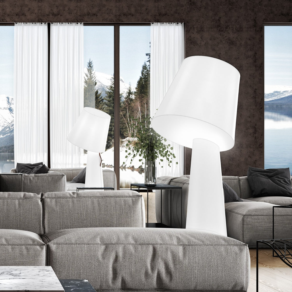 Big Brother 3 Light Fabric Floor Lamp in white, shown in a living room with a tilted drum shade on a tall tapering base, both glowing white fabric.