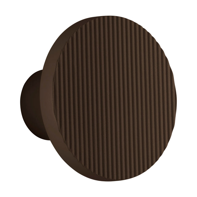 Arid A/01 round aluminium LED wall light in Textured Graphite Brown, a fluted disc on a short stem, shown on a plain white background.