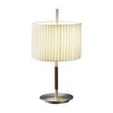 Danona Mini Ribbon Drum Table Lamp with pleated cream fabric shade, slim satin nickel stem with brown leather grip, and round nickel base on a white background.