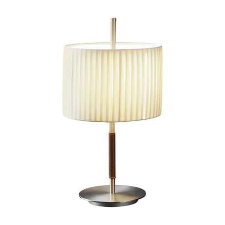 Danona Mini Ribbon Drum Table Lamp with pleated cream fabric shade, slim satin nickel stem with brown leather grip, and round nickel base on a white background.