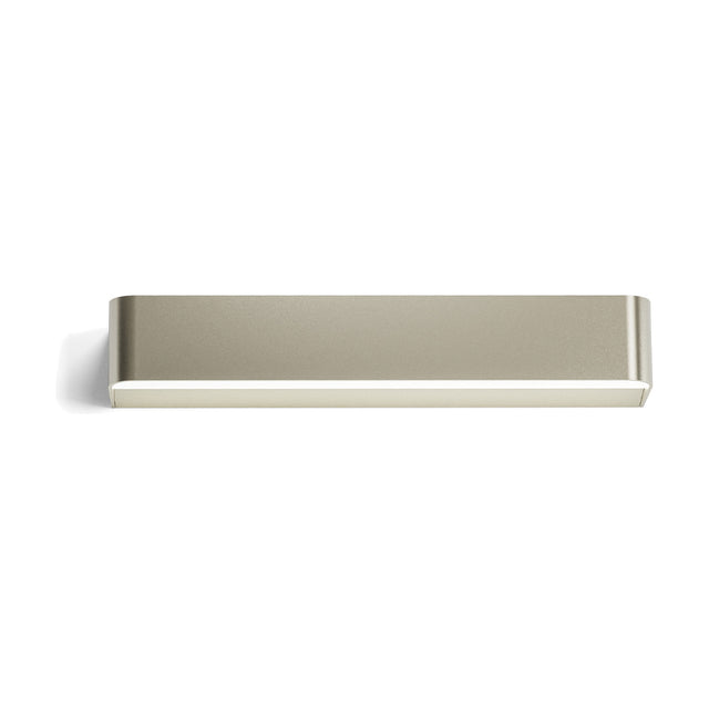 Toy R LED Wall Light 43.7cm, a slim rectangular fitting with rounded ends in a champagne-silver finish, shown front-on with a visible light strip along its lower edge on a plain white background.