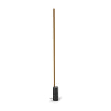 Hilow Line Nero Marquina linear floor lamp with a slim brushed bronze rod rising from a black marble cylinder base, shown on a plain white background.