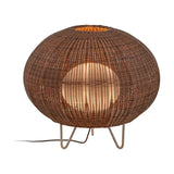 Garota P/01 Globe LED Outdoor Floor Lamp in brown, a wide woven globe shade glowing from within, raised on slim metal hairpin legs against a plain white background.