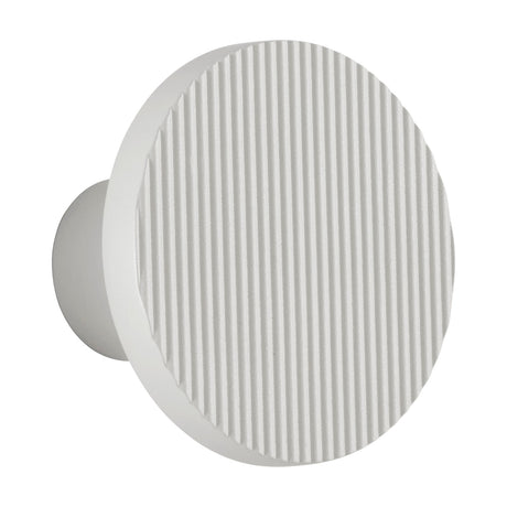 Arid A/01 round LED wall light in Textured White aluminium, with a fluted disc face on a short wall-mounted stem, shown against a plain white background.