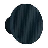 Arid A/01 round aluminium LED wall light with vertically fluted disc face in Textured Grey Blue, mounted on a short cylindrical stem, shown on a plain white background.